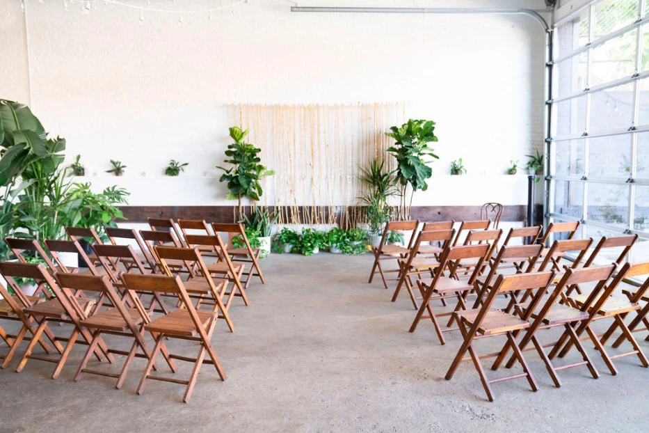 Cool tropical ceremony set up with wedding planner in The Sun Room located in Washington, DC.